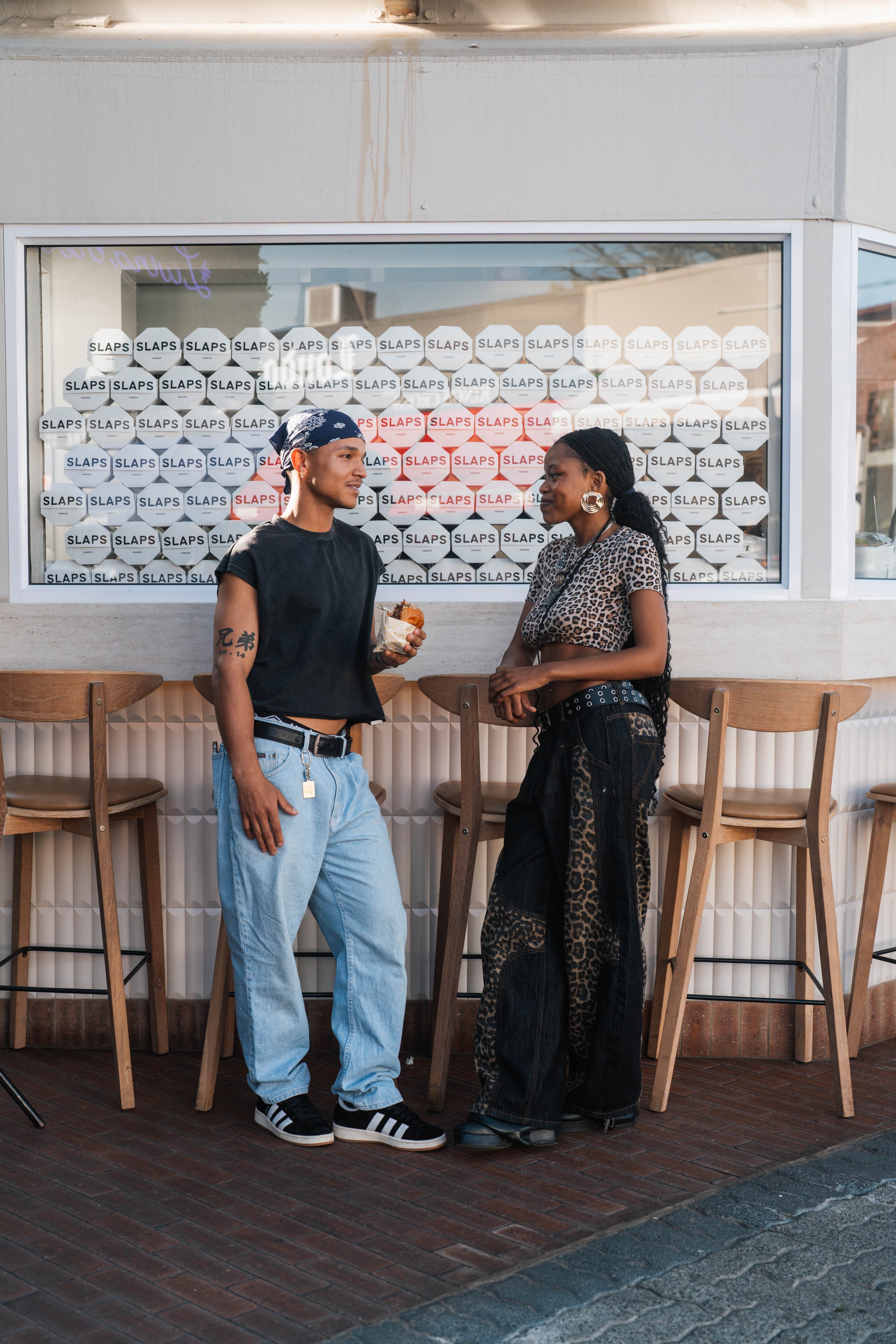 Customers standing outside SLAPS Sandos