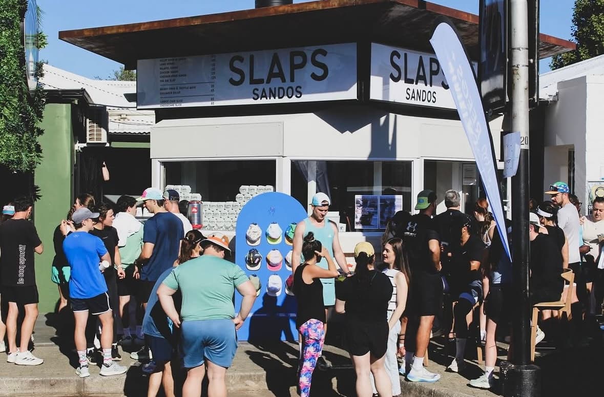 The SLAPS Sandos run club gathered outside the store
